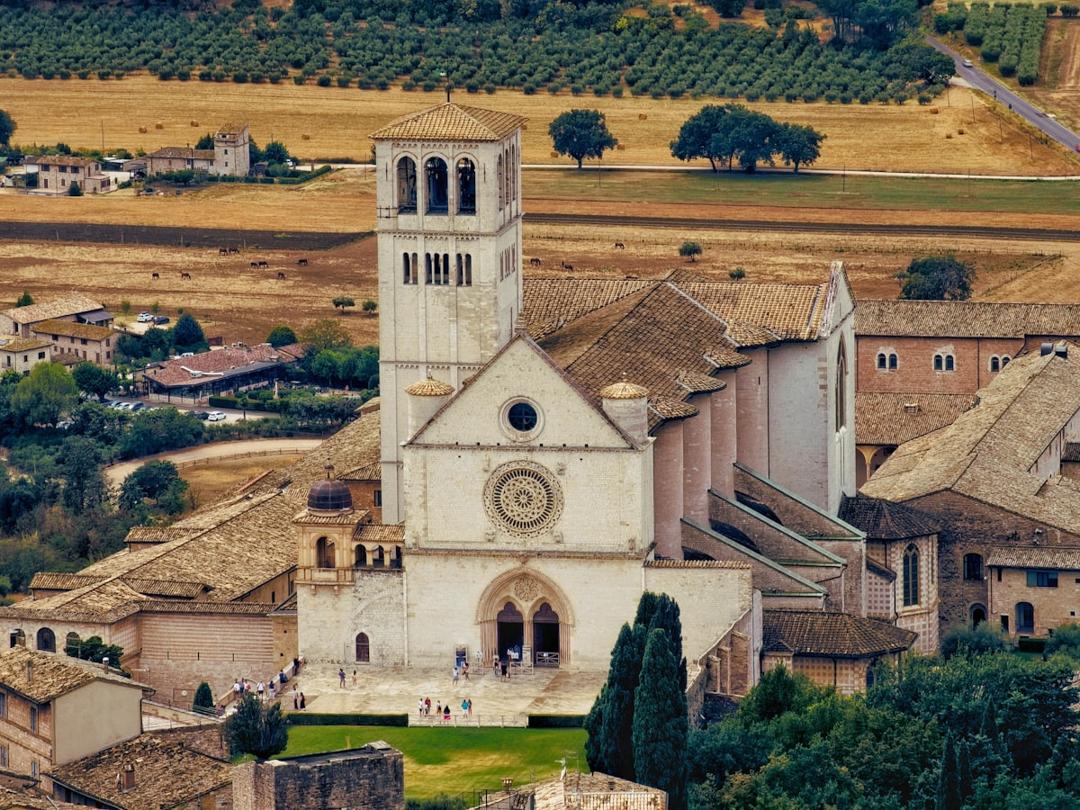 Aerial view of a European church and town along a historic Christian pilgrimage route