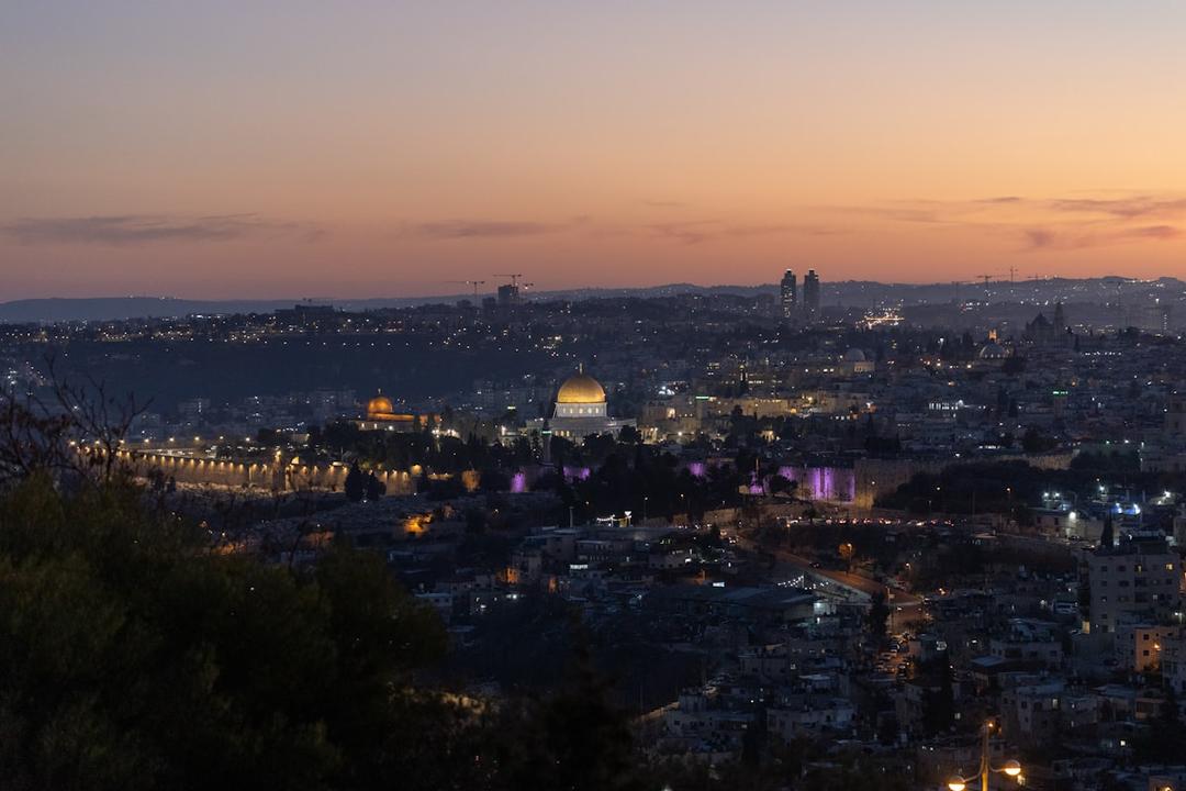 The illuminated skyline of Jerusalem at dusk, center of Jewish pilgrimage heritage