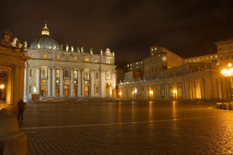 A sweeping view of Rome with historic domes and rooftops