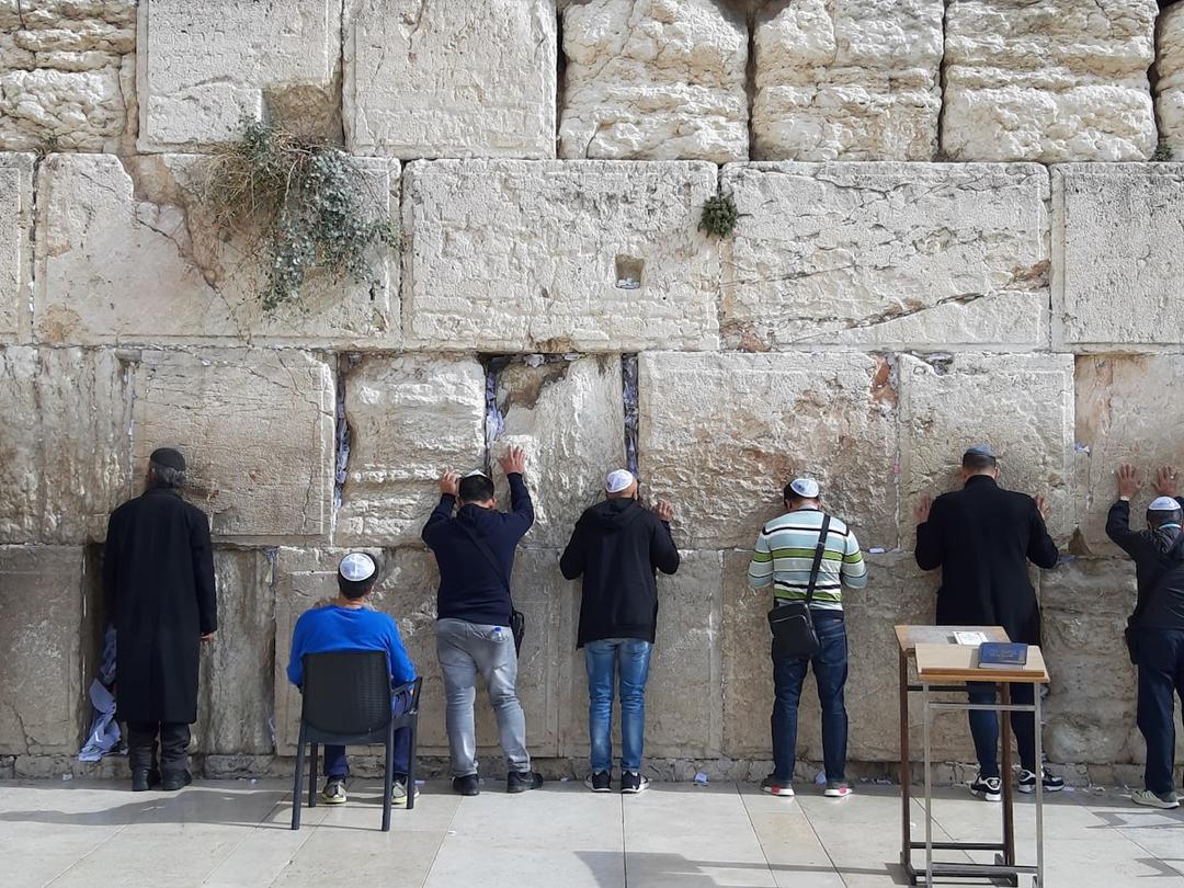 Jewish worshippers praying at the Western Wall in the Old City of Jerusalem