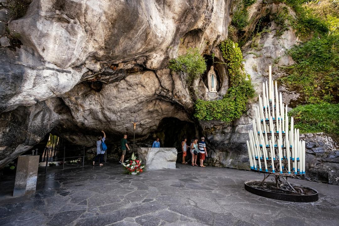 Pilgrims gathered at the Grotto of Massabielle in Lourdes, France