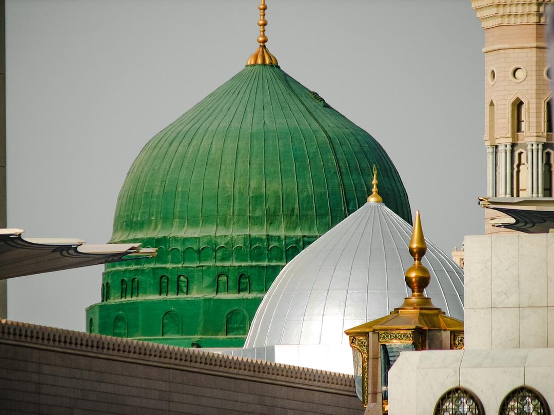 The green dome of the Prophet's Mosque (Al-Masjid an-Nabawi) in Medina