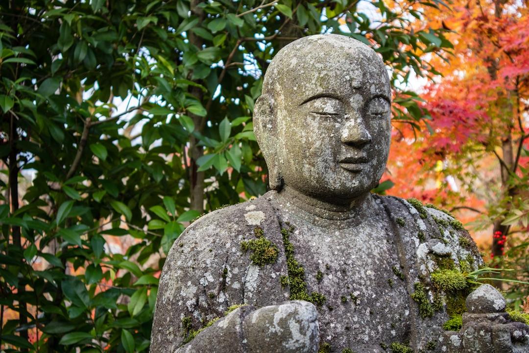 Statue of Kobo Daishi (Kukai) at a temple surrounded by greenery in Japan