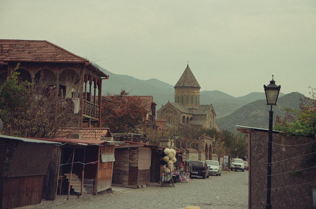 Medieval European town with a church, evoking the pilgrimages of Margery Kempe